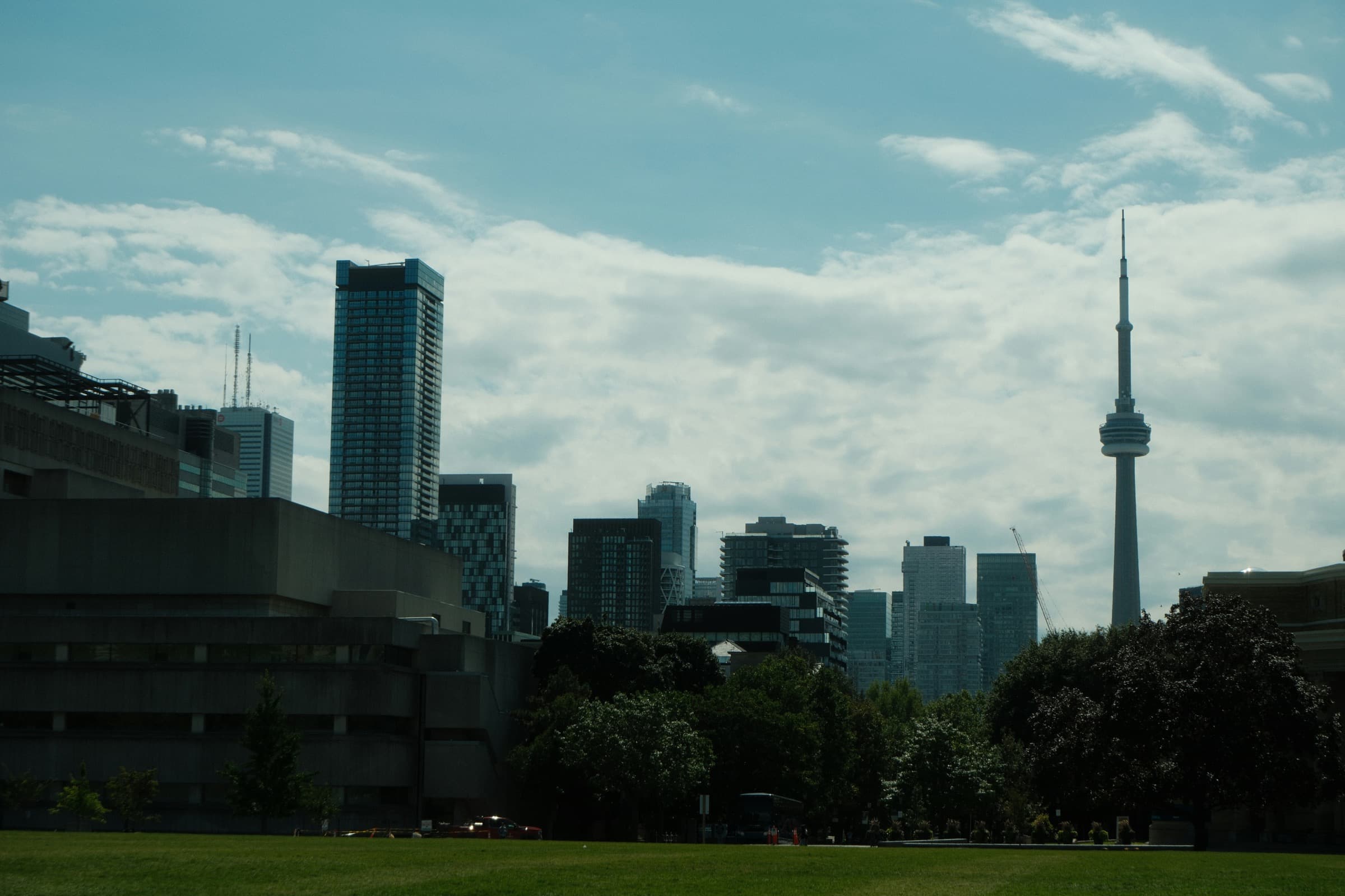 Toronto skyline with residential towers and the CN Tower, illustrating Canadian rental markets